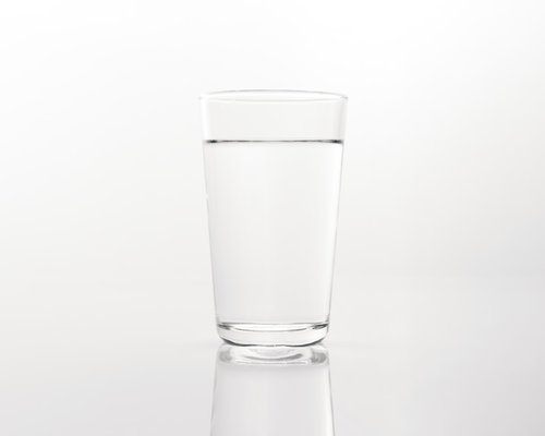 Glass of water with natural light highlighting hydration